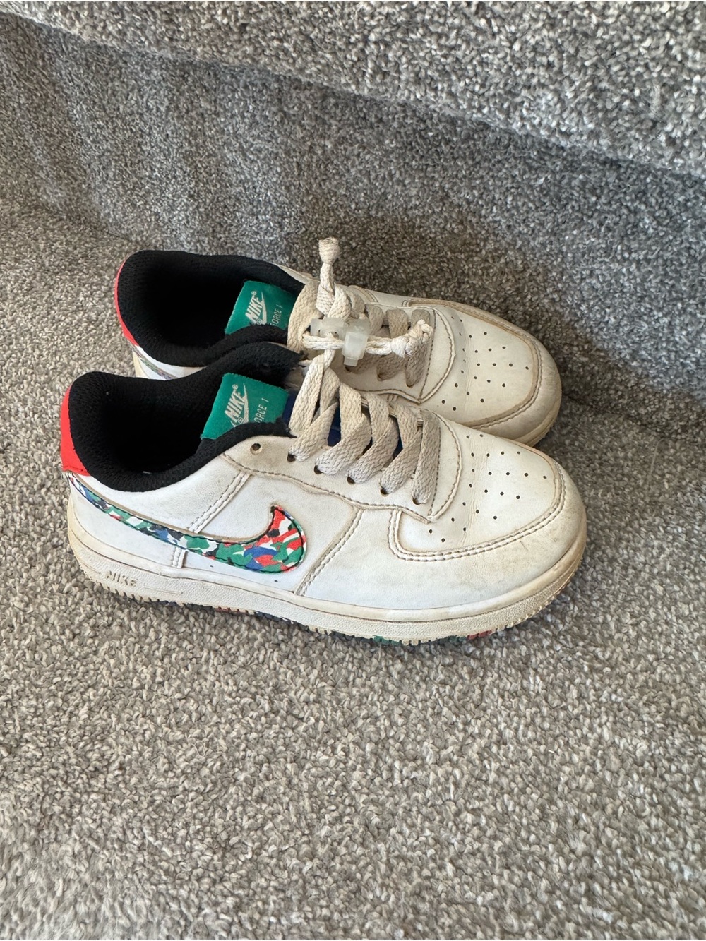 Nike Kids White Sneakers with Multicolor Swoosh and Red Heel